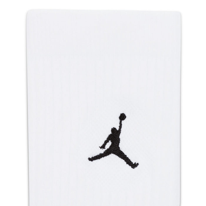 White crew sock close-up with black Jumpman logo on knit fabric