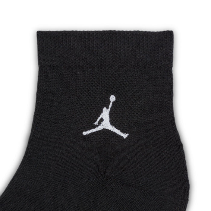Black quarter crew sock with white Air Jordan logo on ankle