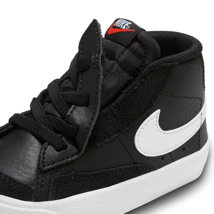 Black toddler high-top sneaker with white swoosh and small Team Orange accent tab.