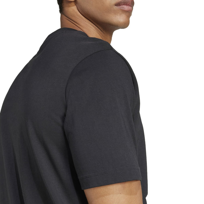 Black short-sleeve T-shirt close-up at shoulder and upper arm.