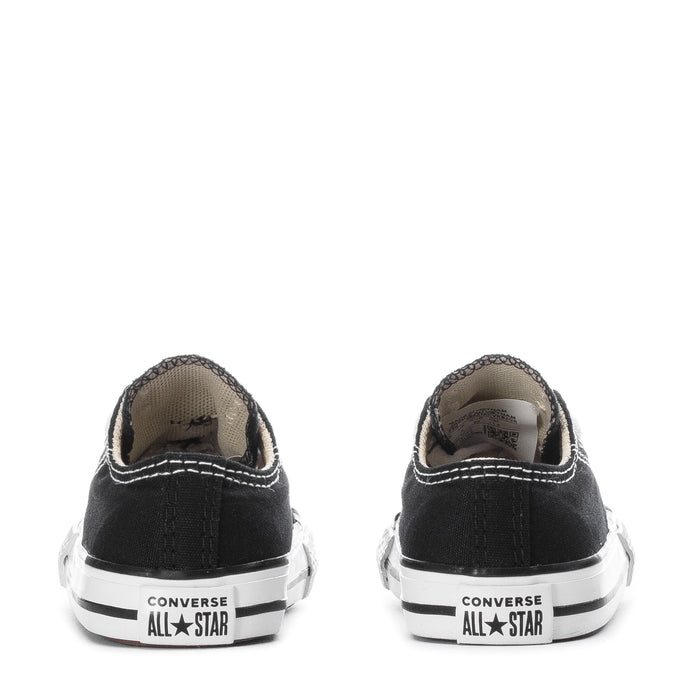 Toddler black canvas Chuck Taylor All Star sneakers, rear view with white rubber sole