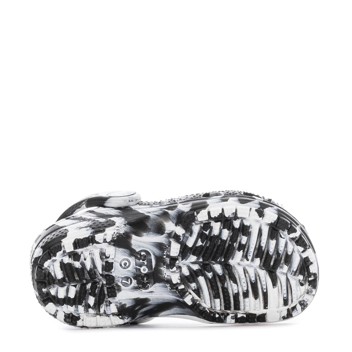 Toddler clog outsole tread in black-and-white marble, bottom view.