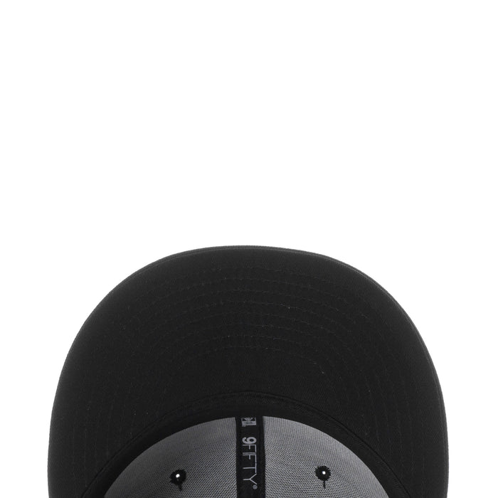 Black cap top close-up with gray inner band and snapback hardware