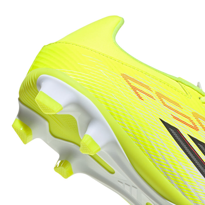Men's soccer cleat side close-up in neon yellow with black stripe graphic and studs