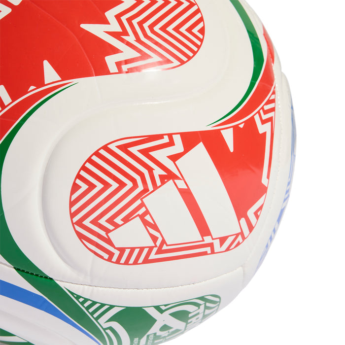 White football close-up with red geometric stripe print, green curve trim, stitched panels.
