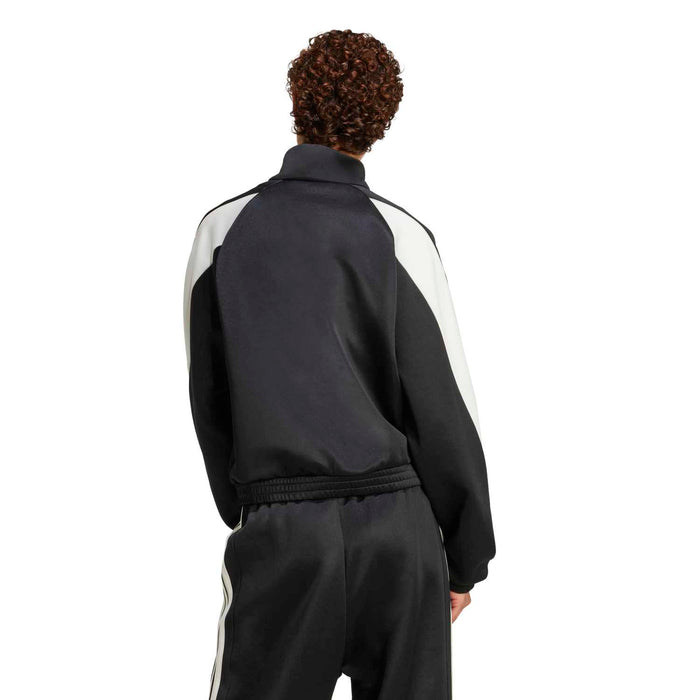 Black womens stadium tracktop with off-white shoulder paneling and back seam.