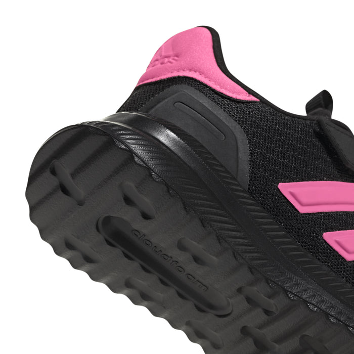 Kids black sneaker side view with pink heel and rugged tread outsole
