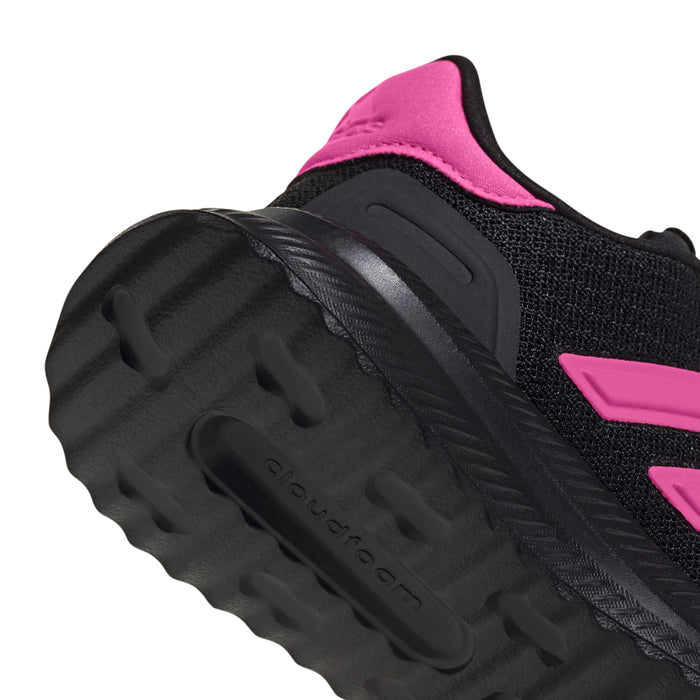 Youth black sneaker outsole view with pink heel collar and tread pattern