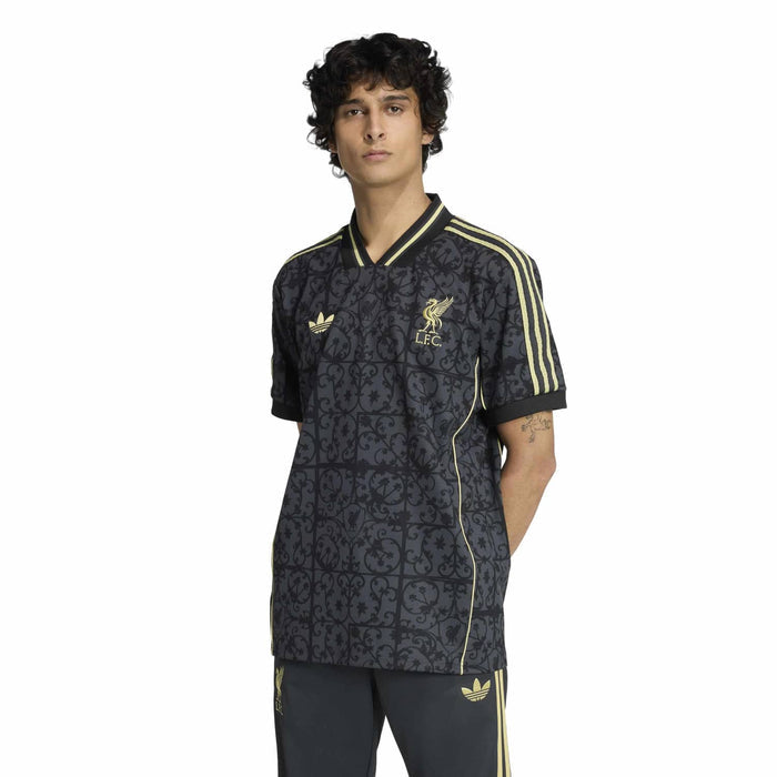 Men's navy Liverpool jersey with gold piping, chest crest, and patterned fabric; short sleeves.