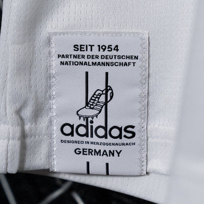 White inner label patch with adidas logo and text "DEUTSCHER NATIONALMANNSCHAFT"