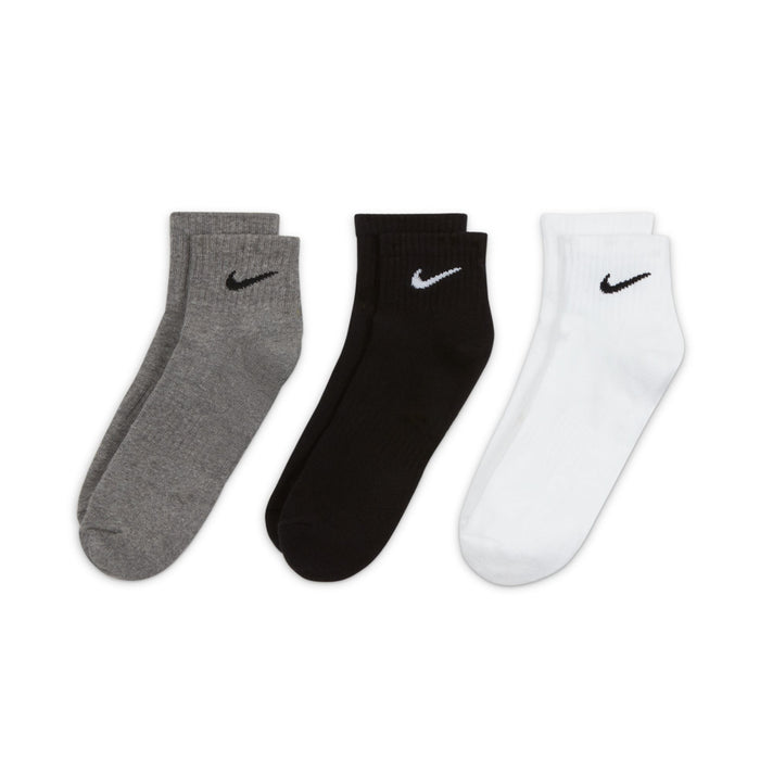 Three pairs of quarter crew socks: gray, black, and white with Nike swoosh