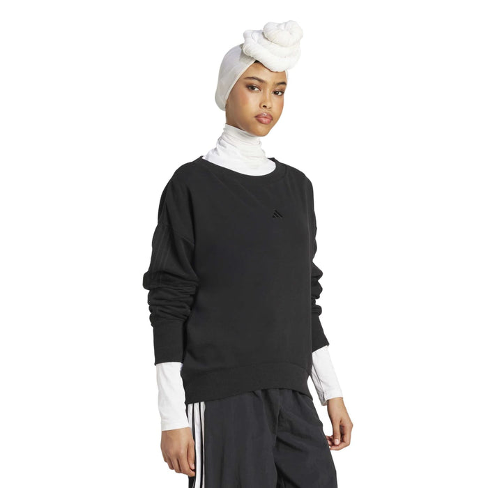 Women's loose black sweatshirt, back view, crew neck, long sleeves with ribbed cuffs