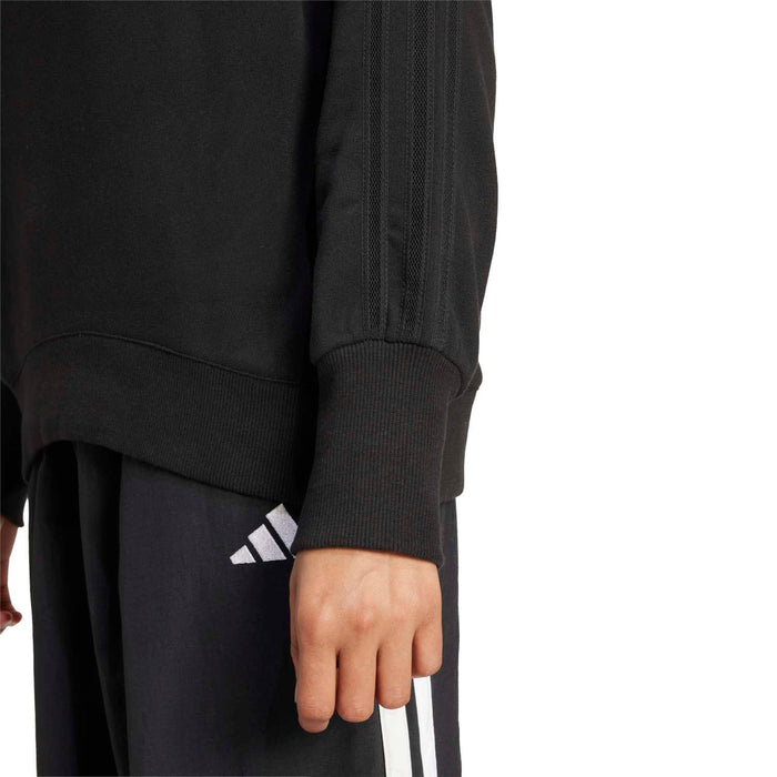 Black sweatshirt sleeve cuff with ribbed knit and small logo on upper sleeve