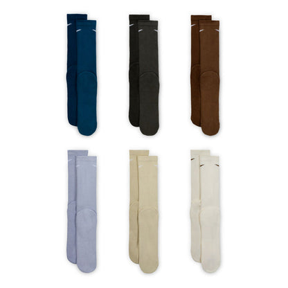 Six-pack unisex crew socks in assorted colors, shown folded upright