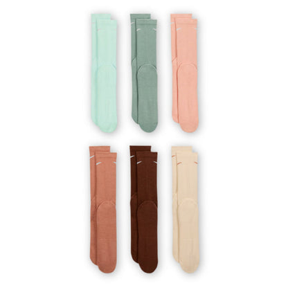 Crew sock assortment in mint, olive, peach, and brown tones, six-pair layout