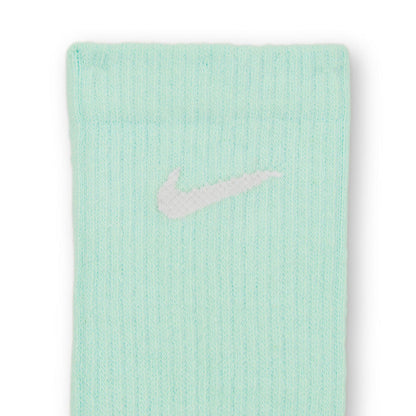 Mint crew sock close-up with Nike logo on ribbed fabric