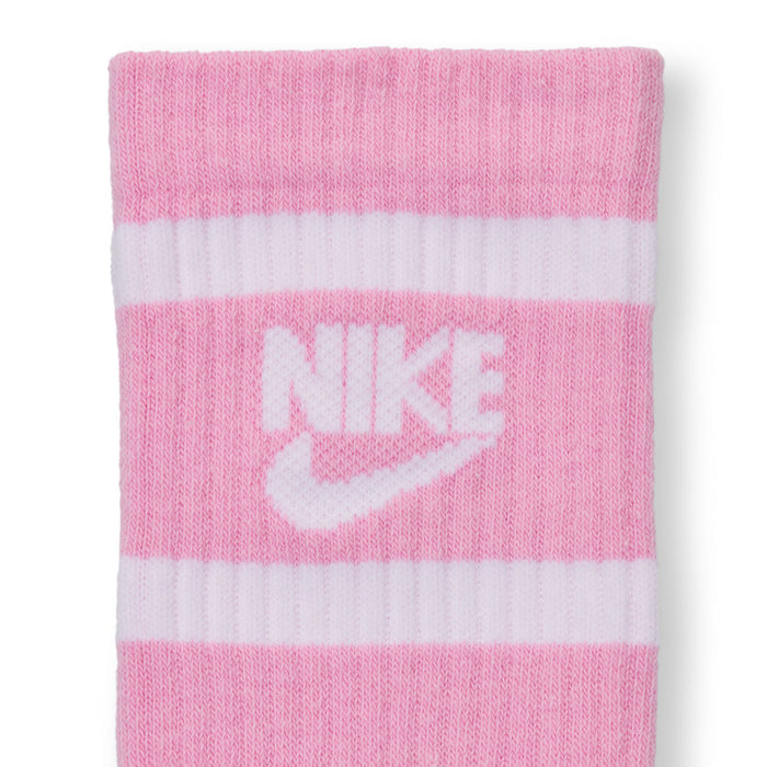 Youth crew socks close-up, pink with white Nike swoosh and stripe bands