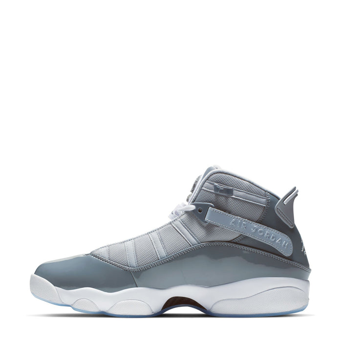 Mid-top sneaker in cool grey and white, side view with lace-up and padded collar