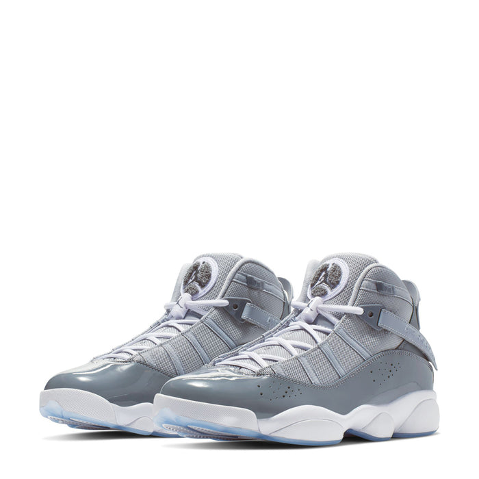 Pair of mid-top sneakers in cool grey and white with laces and perforated panels