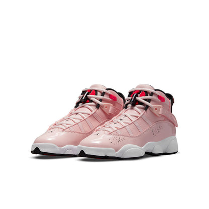 Youth pink high-top sneakers, side view, with black toe cap, red laces, and white sole