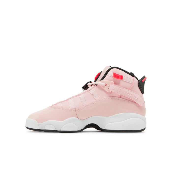 Youth pink high-top sneakers with black heel strap, white midsole, and red lace pull