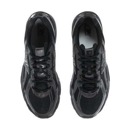 Pair of men's New Balance sneakers viewed from top, black mesh upper