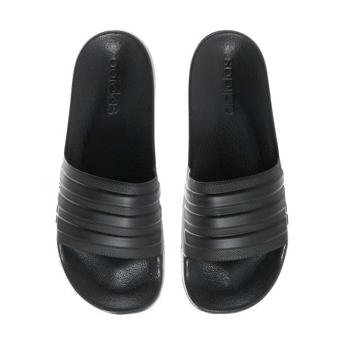 Pair of black slide sandals with adidas branding on the strap and cushioned footbed