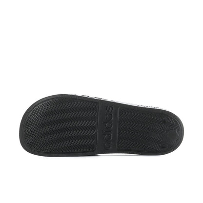 Black slide sandal outsole with chevron tread pattern and adidas logo