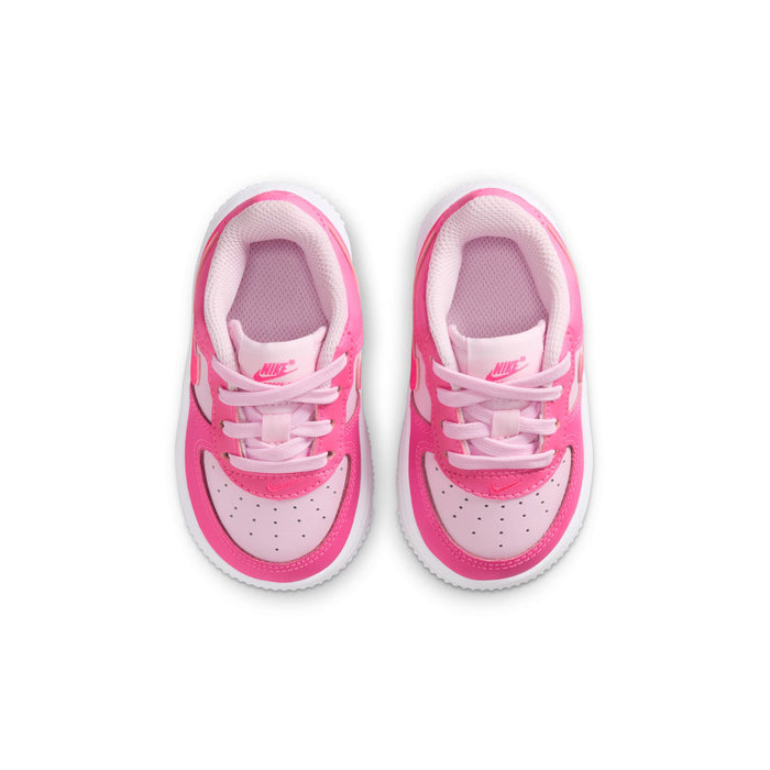 Toddler Nike Air Force 1 sneakers with pink uppers, white toe box, front lace-up view