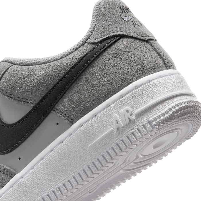 Youth Air Force 1 midsole close-up, smoke gray suede with Air text on white outsole