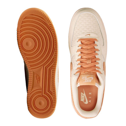 Nike Air Force 1 low-top sneakers outsole and insole, orange rubber and cream interior.