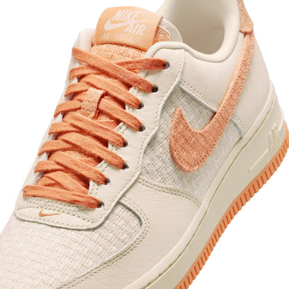 Women’s Air Force 1 upper with orange laces and textured tongue, cream leather panels.