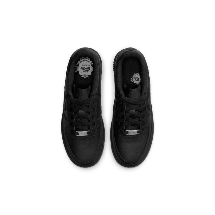 Black youth low-top sneakers viewed from toe and laces; insoles shown