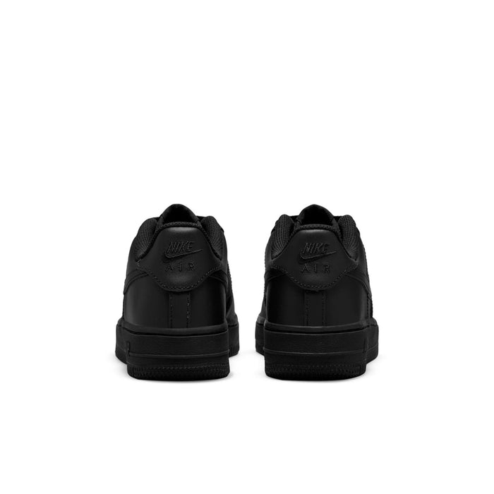 Black youth low-top sneakers with cushioned heel tabs; rear view