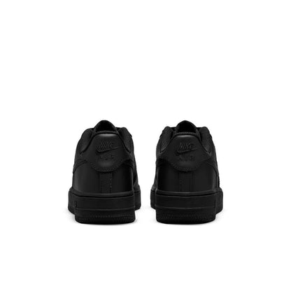 Black youth low-top sneakers with cushioned heel tabs; rear view