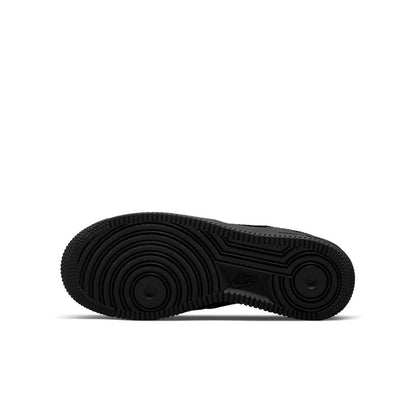 Black youth low-top sneaker outsole with traction pattern; bottom view