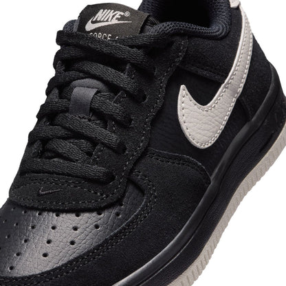 Kids Air Force 1 lace sneaker close-up, black upper with light bone swoosh
