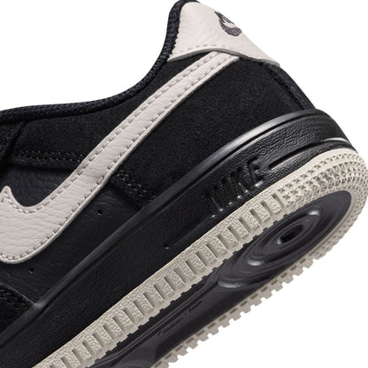 Air Force 1 midsole close-up, black foam with Air unit and light tread edge
