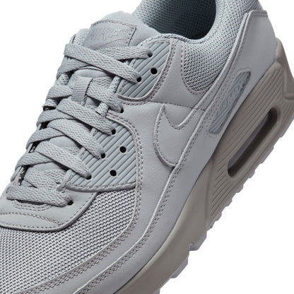 Men's light gray Air Max 90 sneaker upper close-up, laces and swoosh logo