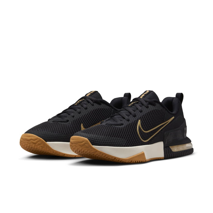 Black and white athletic shoe with gold swoosh and gum outsole