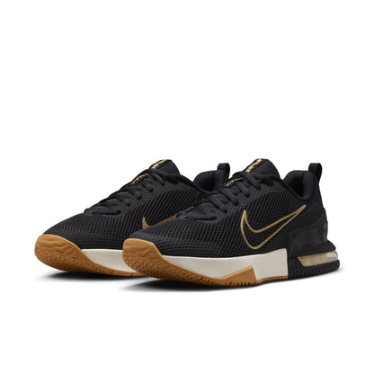 Black and white athletic shoe with gold swoosh and gum outsole