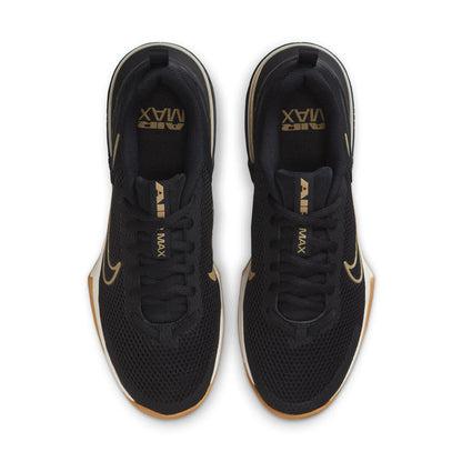Black low-top sneakers with gold accents and lace-up front