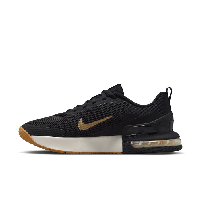 Black low-top trainer with gold swoosh, white mid panel, and tan outsole