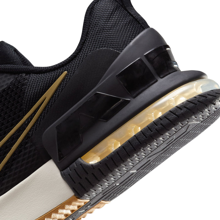 Close-up of black outsole and clear air-cushion unit with gold accents