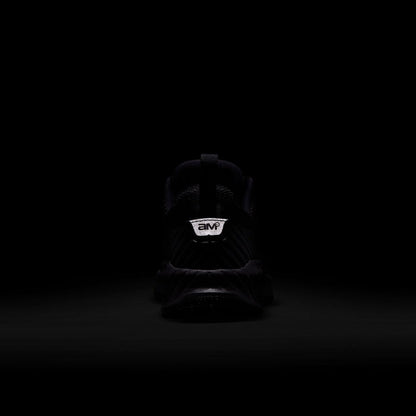 Youth black sneaker heel with branding on the back tab