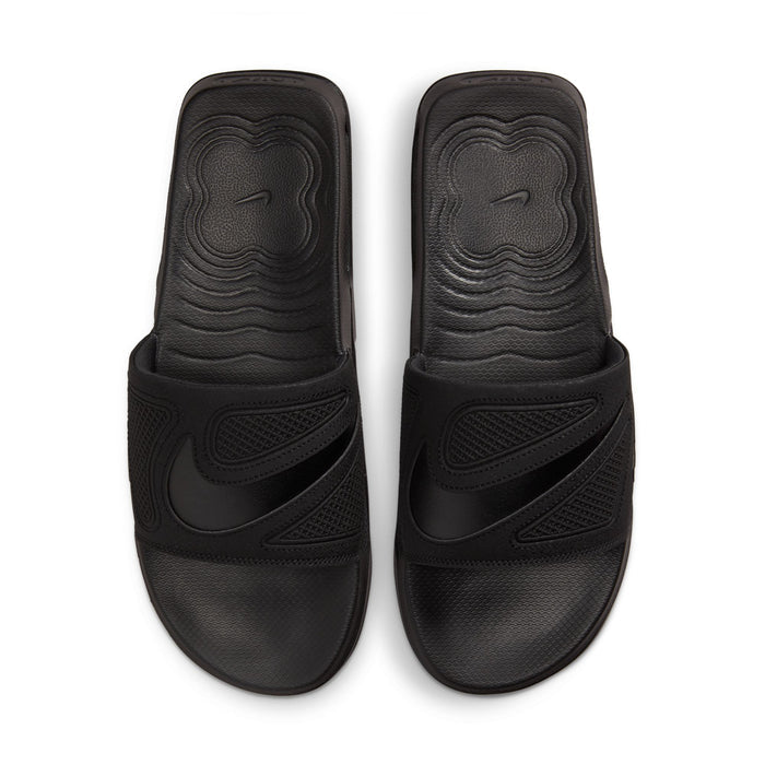 Pair of black slide sandals with molded logo on footbed