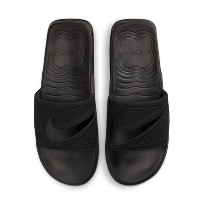 Pair of black slide sandals with molded logo on footbed