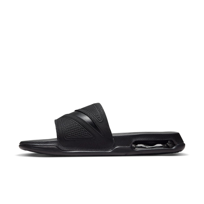 Black slide sandal, side view showing textured strap and Air sole unit