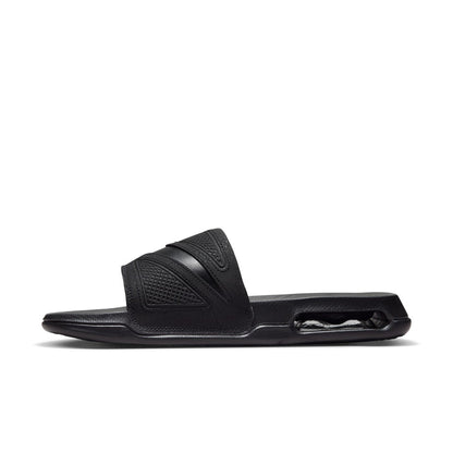Black slide sandal, side view showing textured strap and Air sole unit