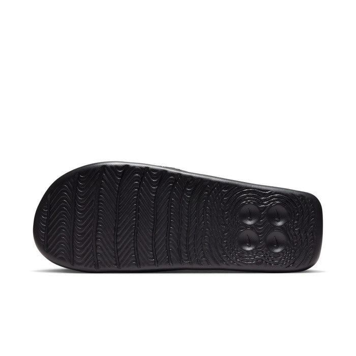 Black slide sandal outsole with herringbone traction pattern